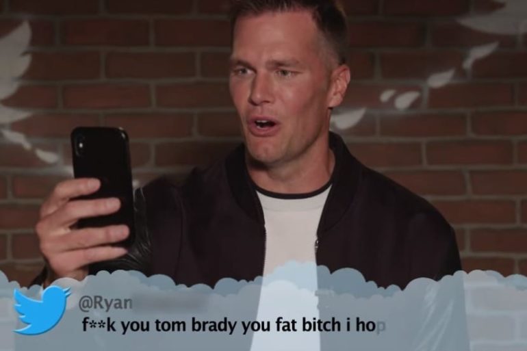Tom Brady holding a phone