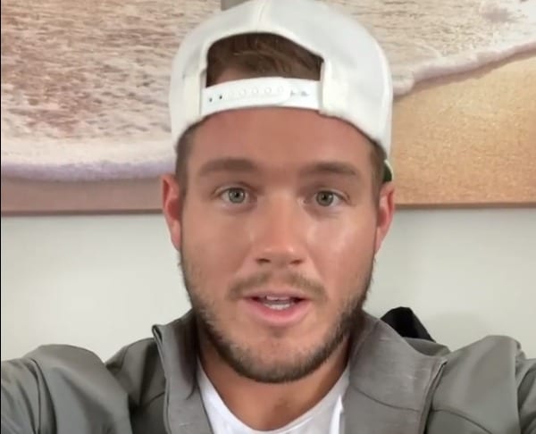 Colton Underwood wearing a white hat