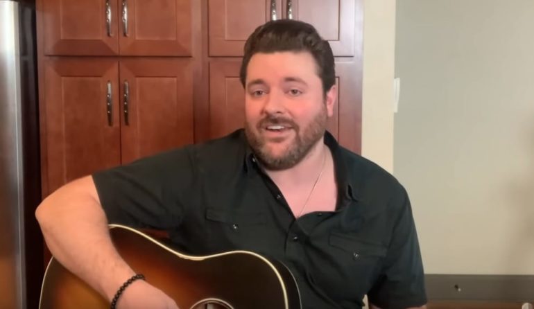 Chris Young sitting in a chair