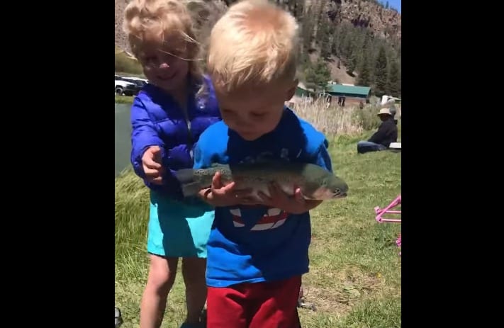 A boy holding a fish