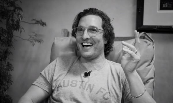Matthew McConaughey with glasses smiling