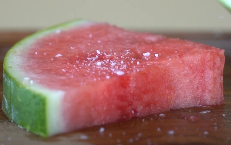 A watermelon with a bite taken out