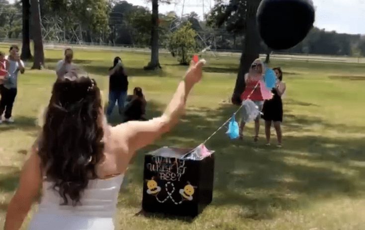 A woman throwing a frisbee