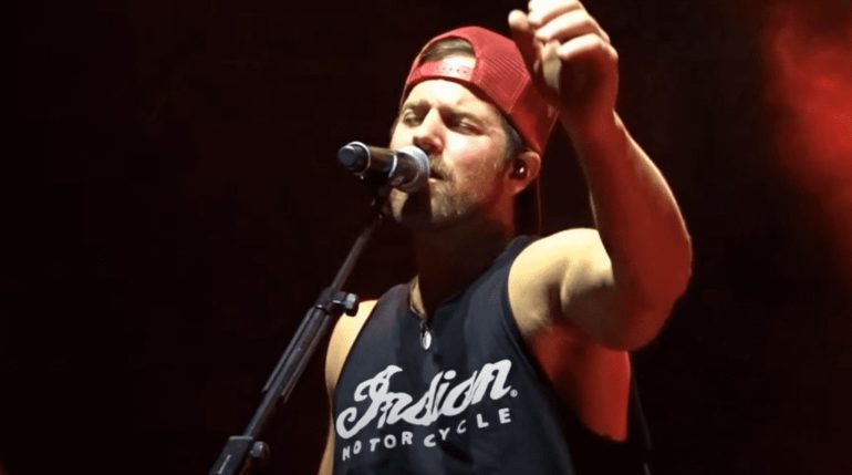 Kip Moore with a microphone