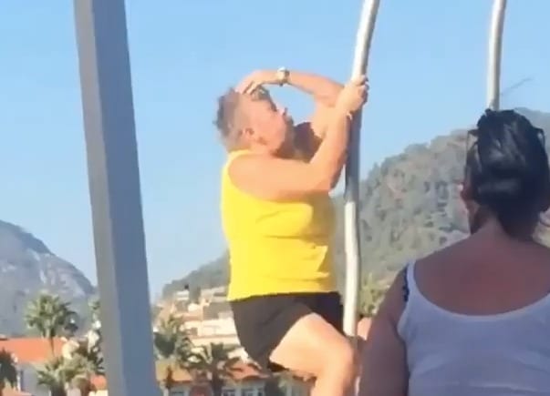 A person swinging a golf club
