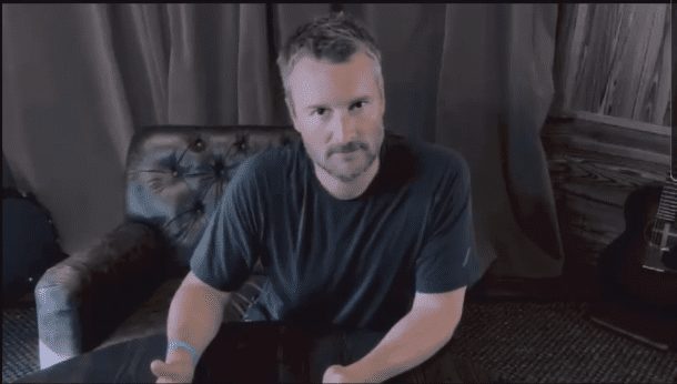 Eric Church sitting on a couch