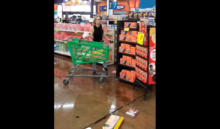 A person pushing a shopping cart