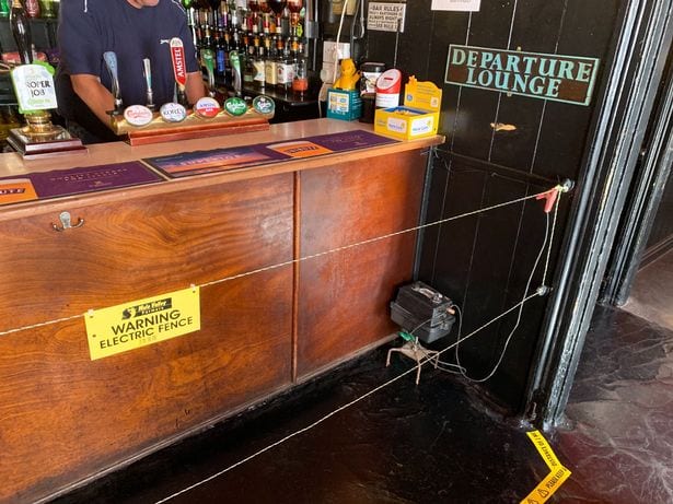 A bar with a bar and a sign on it