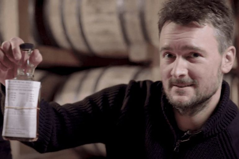Eric Church holding a bottle of wine