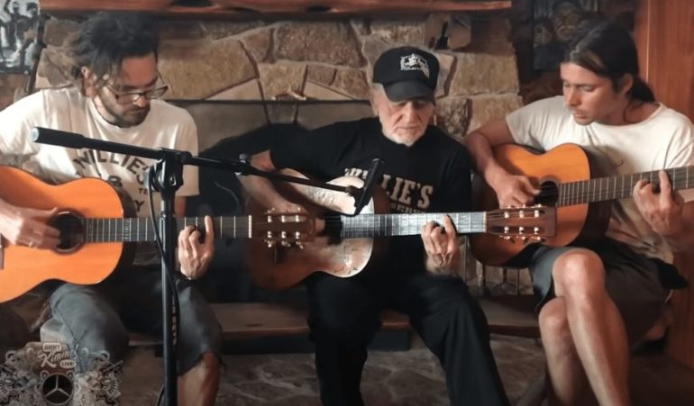 A group of people playing guitars
