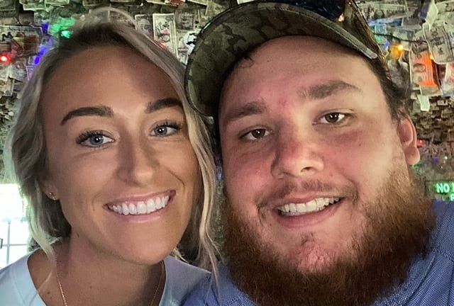 Luke Combs and woman smiling