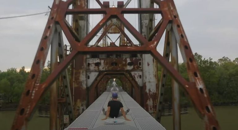 A person walking on a bridge