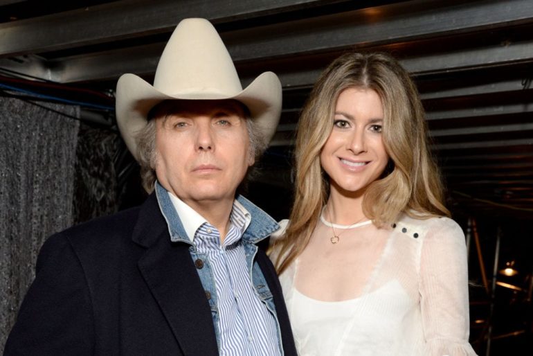 Dwight Yoakam and woman posing for a picture
