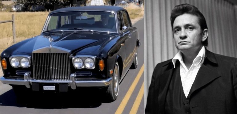 Johnny Cash standing next to a car