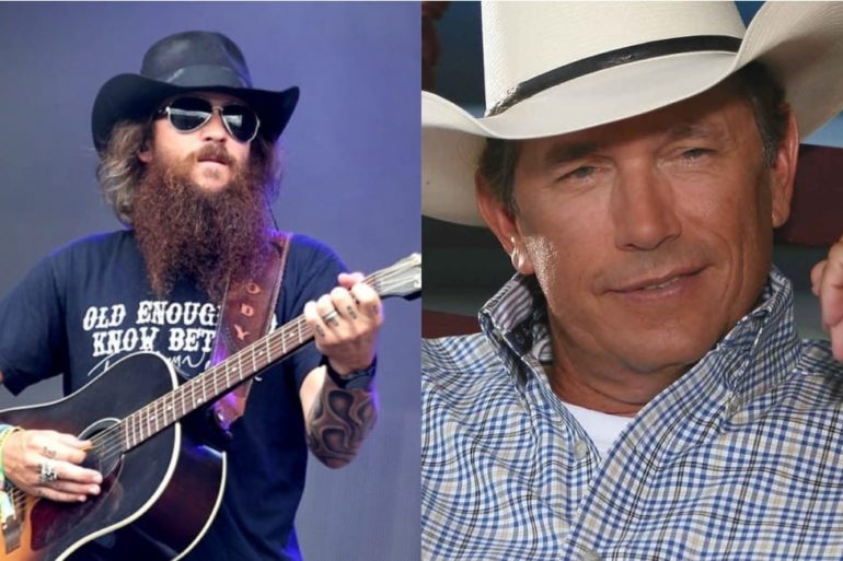 George Strait with a beard and a hat holding a guitar