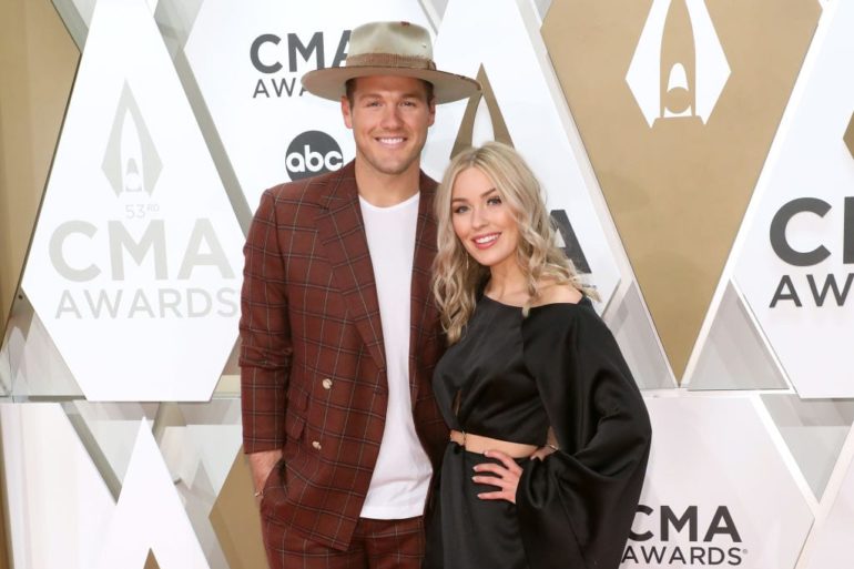 Colton Underwood and woman posing for a photo