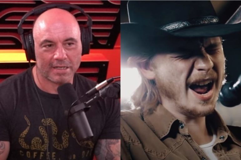 Joe Rogan with a mustache and a man with a microphone in front of him