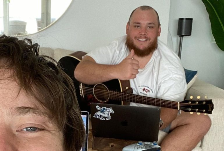 Luke Combs playing a guitar next to a woman holding a guitar