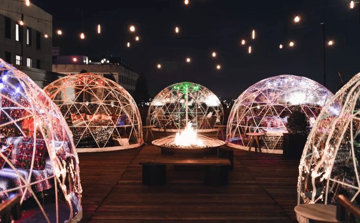 A group of large round balls with lights on them