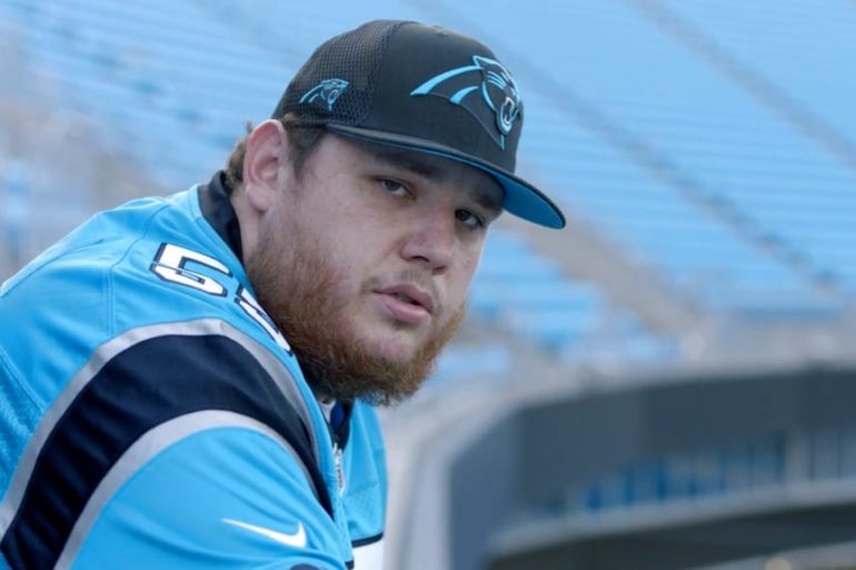 Luke Combs wearing a uniform