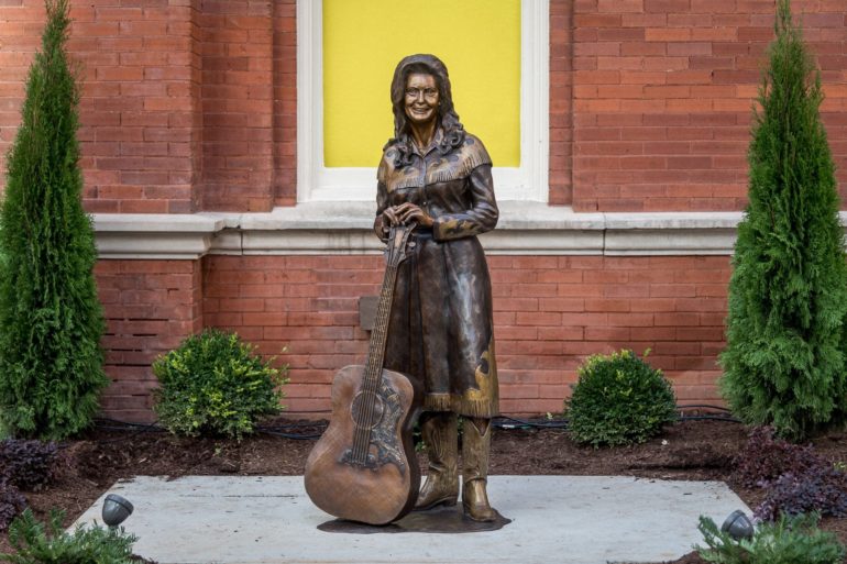 A statue of a person holding a sword