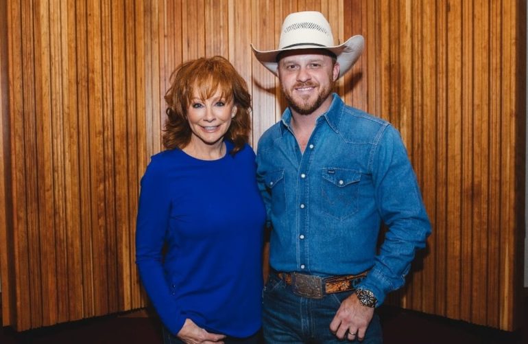 Reba McEntire and woman posing for a picture