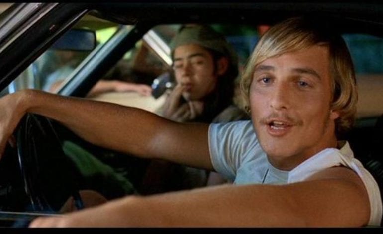 Matthew McConaughey and woman driving a car