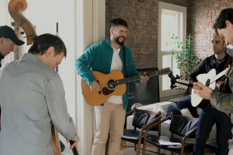A man playing a guitar