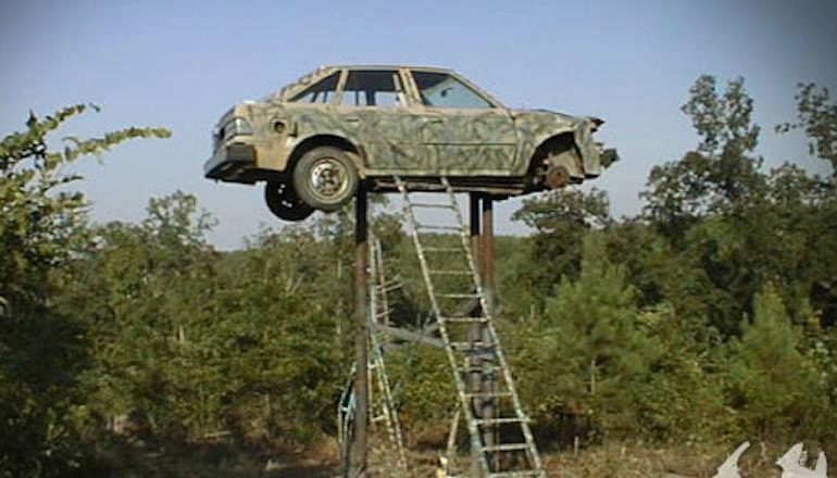 A car upside down on a ladder