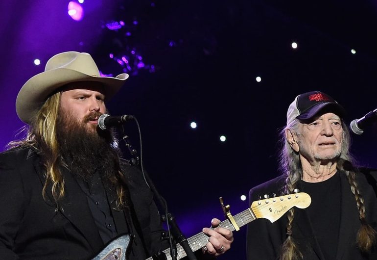 Willie Nelson, Chris Stapleton are posing for a picture