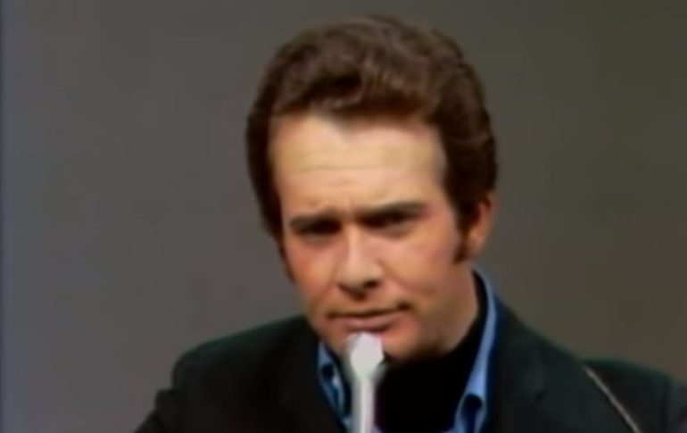 Merle Haggard with a white substance on his face