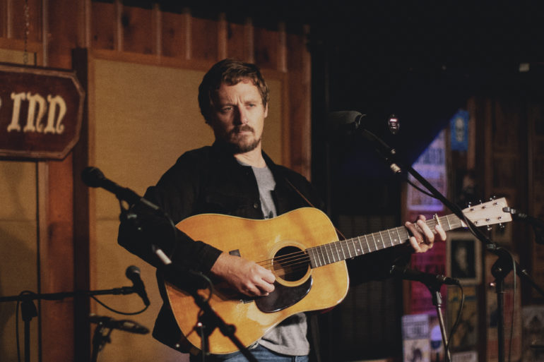 Sturgill Simpson playing a guitar