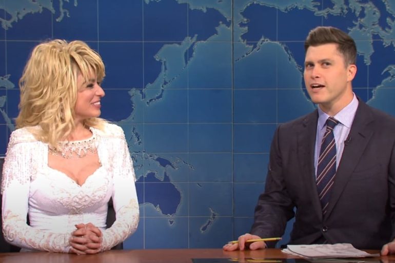 Colin Jost and woman talking