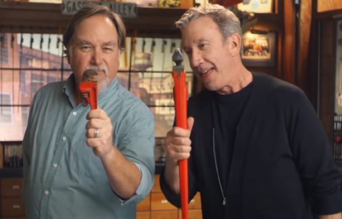 Richard Karn holding a red object