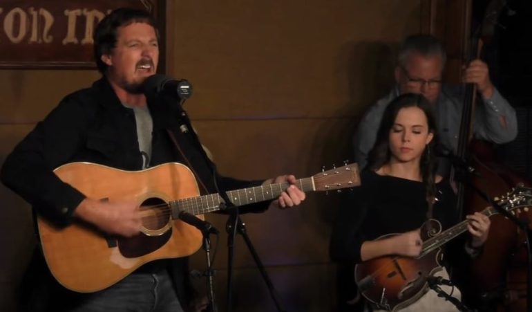 Sturgill Simpson and woman playing guitars