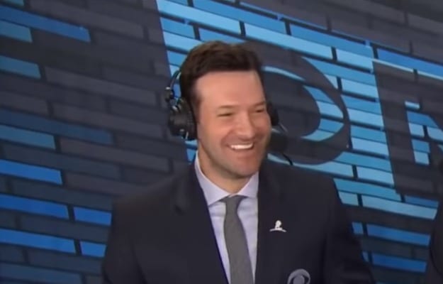 Tony Romo wearing a suit and tie