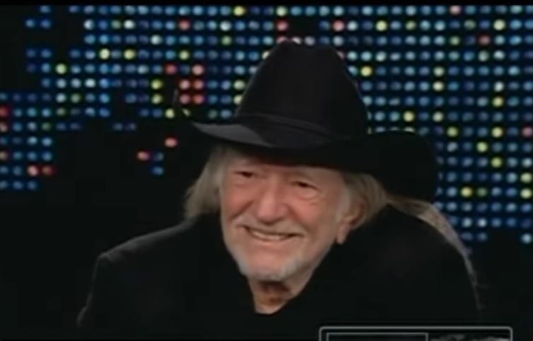 Willie Nelson wearing a hat