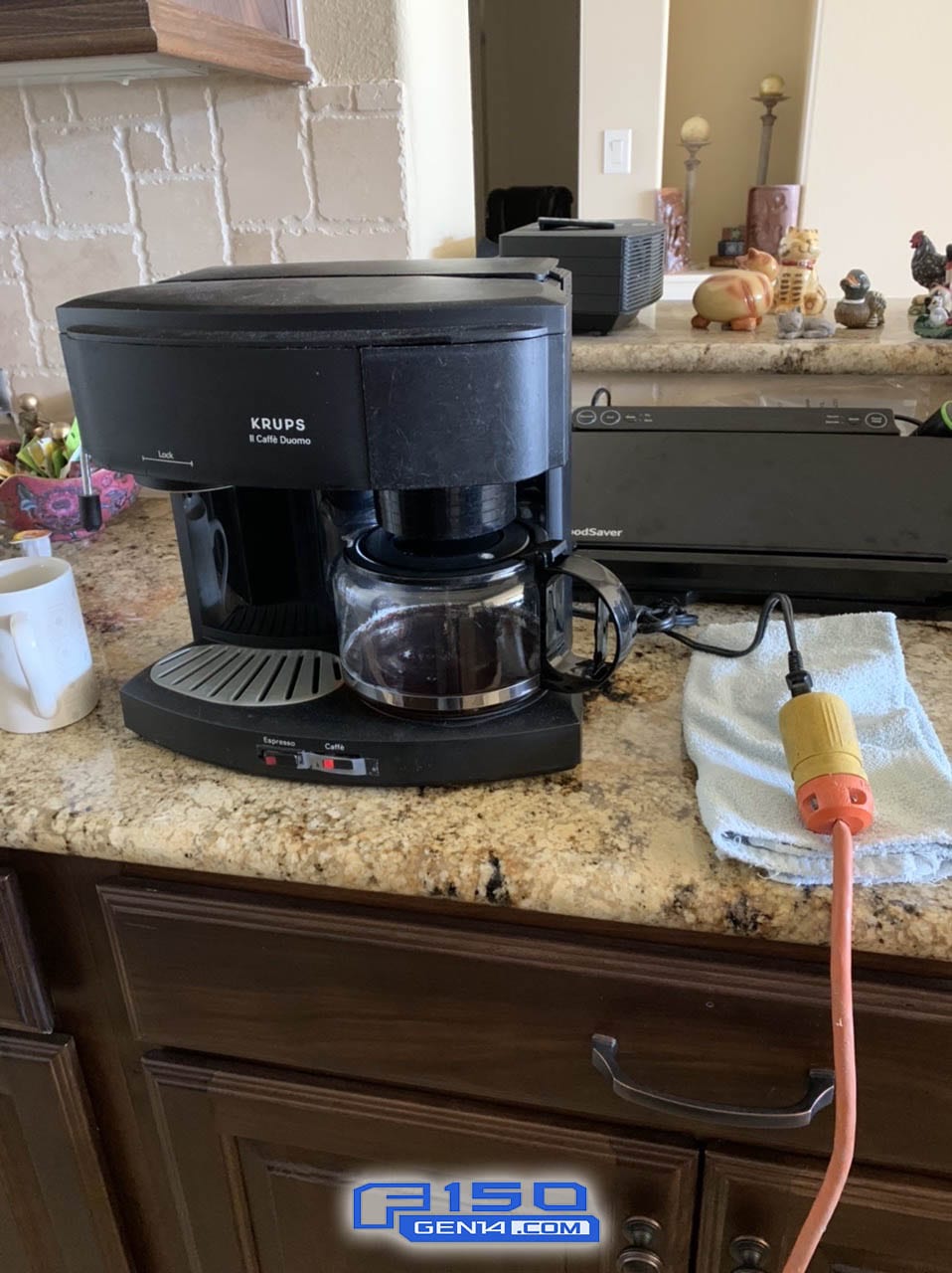 A black coffee maker on a counter