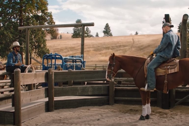 A couple of people riding horses