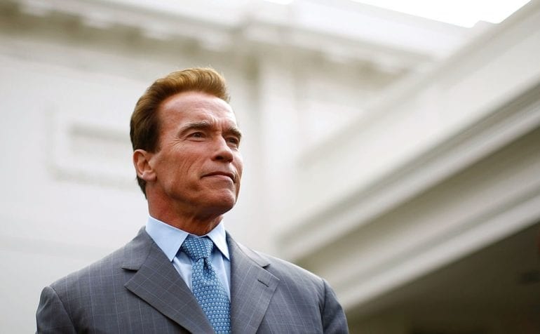 Arnold Schwarzenegger in a suit and tie