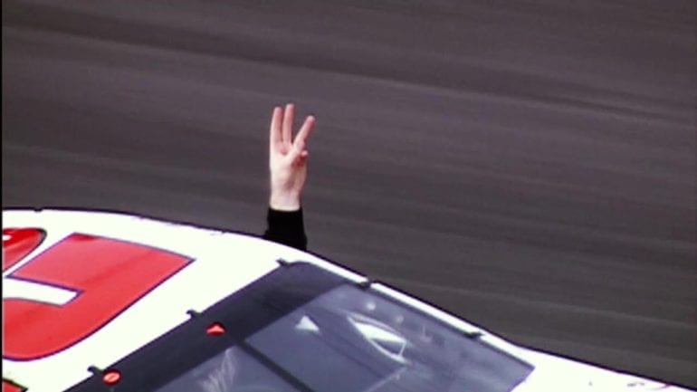 Kevin Harvick flashes 3 fingers after first career win