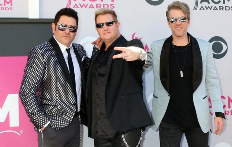 Jay DeMarcus, Gary LeVox et al. are posing for a picture