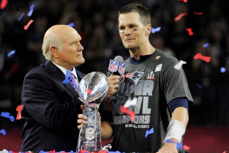 Tom Brady holding a trophy