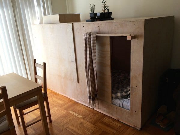A wooden cabinet with a fireplace