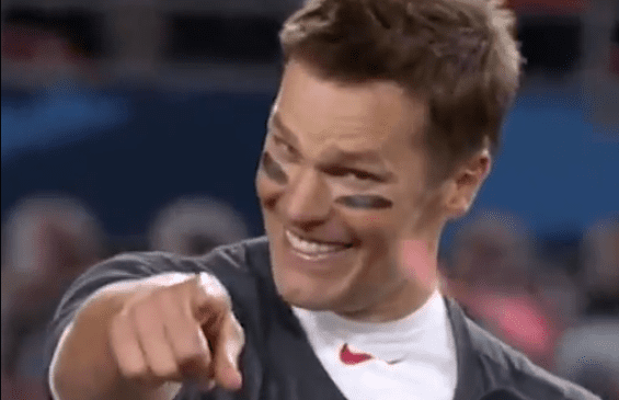 Tom Brady smiling and pointing