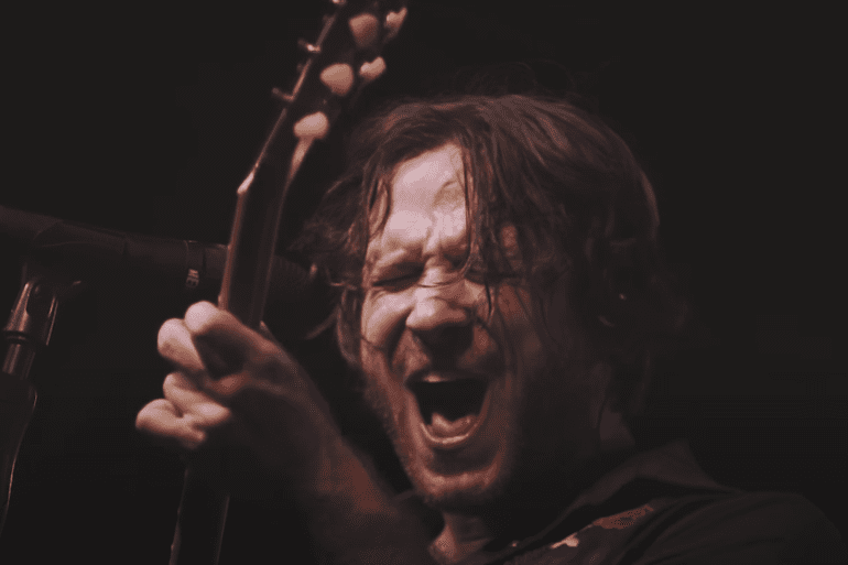 A man singing into a microphone