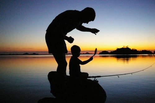 A man and a child fishing