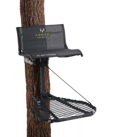A black and silver object on a wooden pole