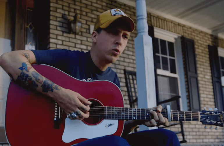 A man playing a guitar