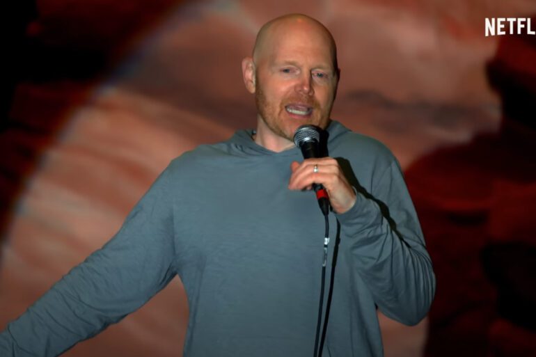 Bill Burr speaking into a microphone